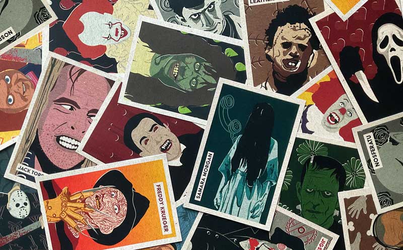 A photo of various horror movie villain postcards.