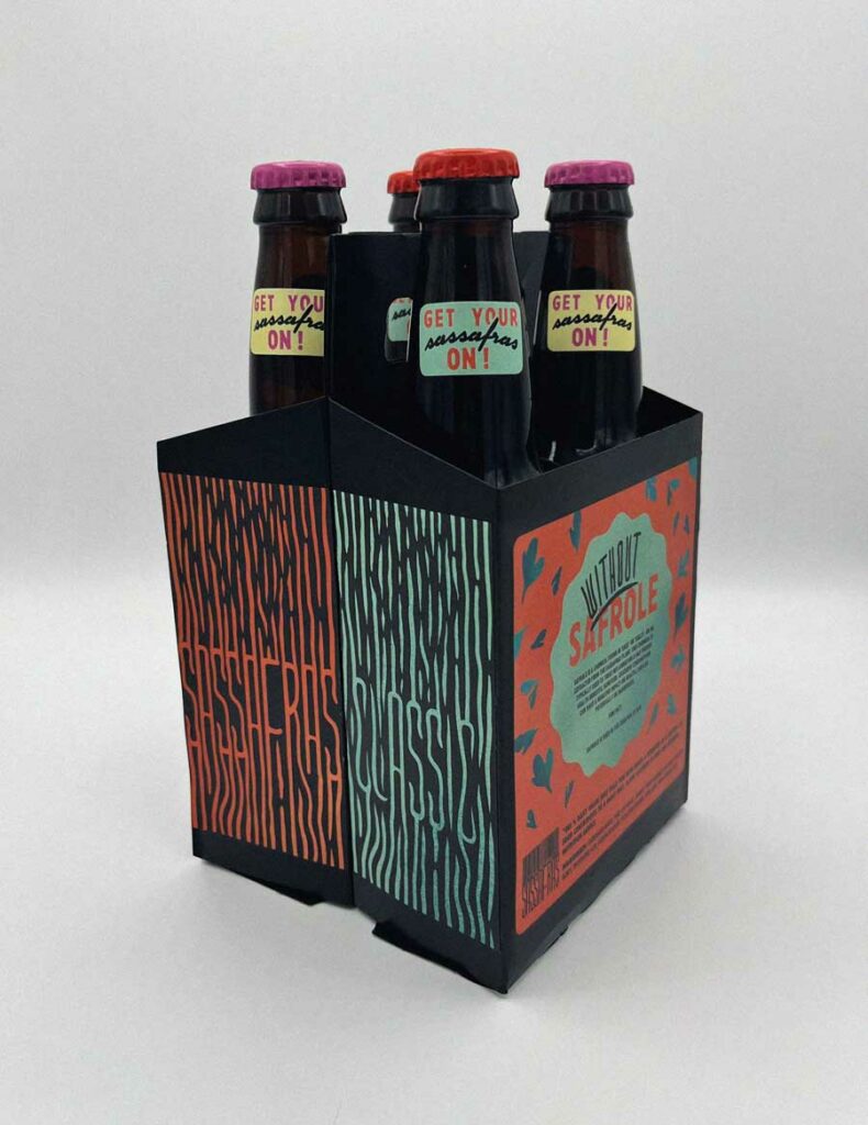 Four pack of Spencer's root beer (assorted flavors) against a white back ground.