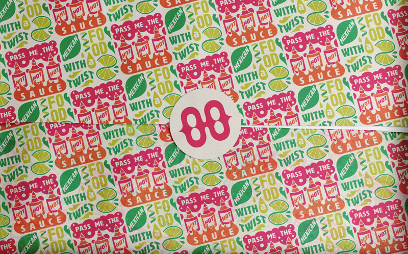 Colorful patterned paper by Lisa Guenther Design featuring repeated text "PASS ME THE SAUCE" and "FOOD WITH A TWIST," plus sauce bottles, limes, and leaves; sealed with a round "88" sticker. A playful touch of graphic design flair!.